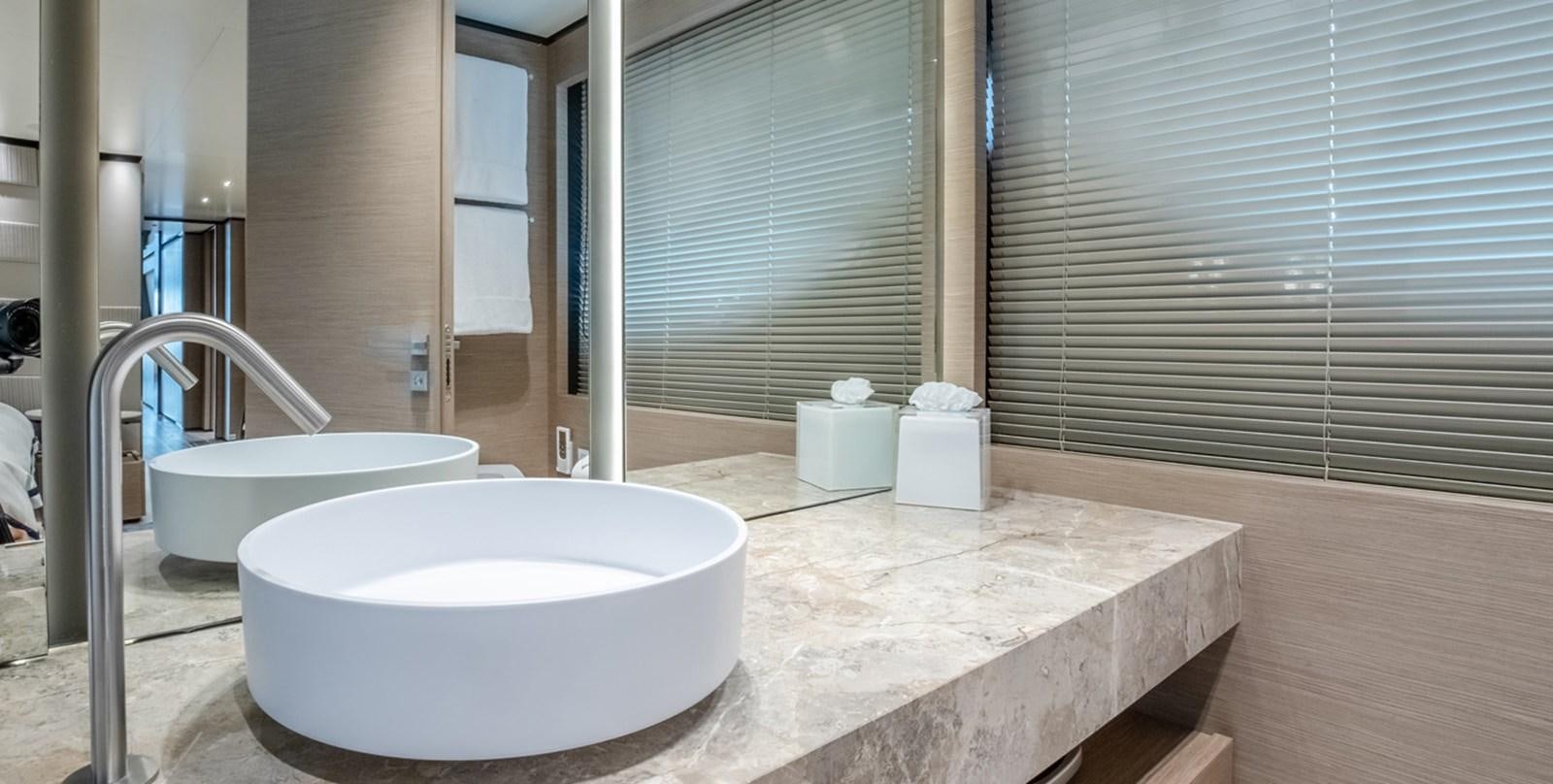 a bathroom with a sink and a large window aboard OCEAN Z Yacht for Sale