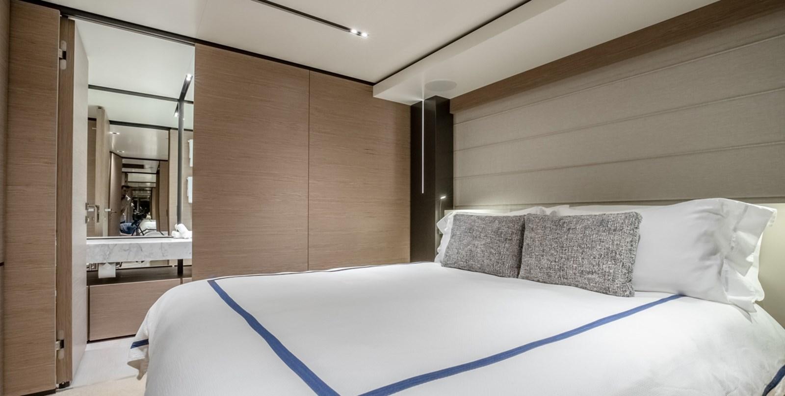 a bed in a room aboard OCEAN Z Yacht for Sale