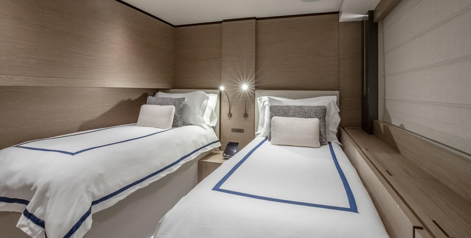 a room with two beds aboard OCEAN Z Yacht for Sale