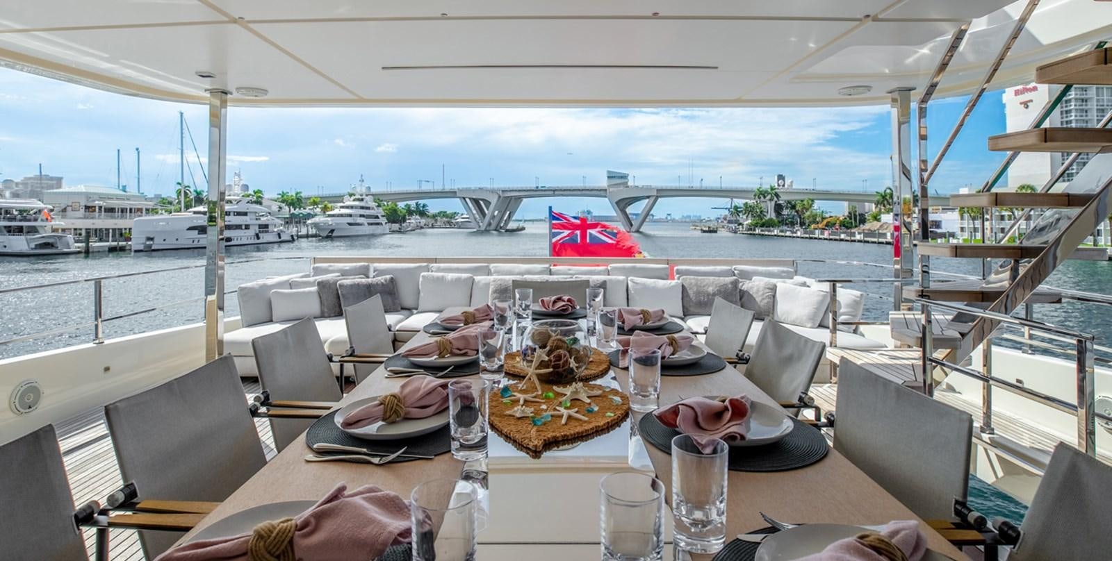 a table set for a meal aboard OCEAN Z Yacht for Sale
