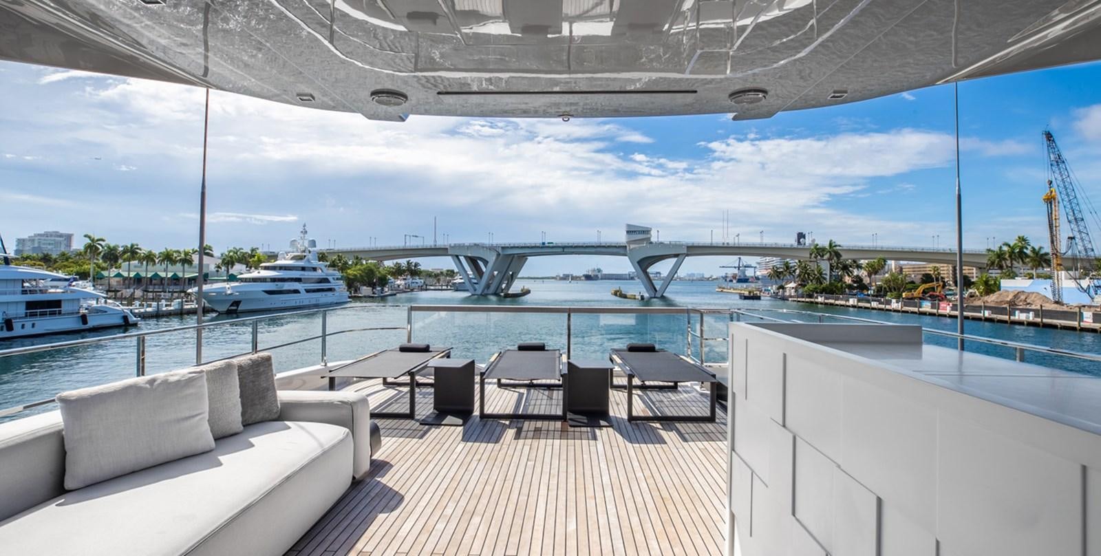a deck with a view of a boat and a large body of water aboard OCEAN Z Yacht for Sale
