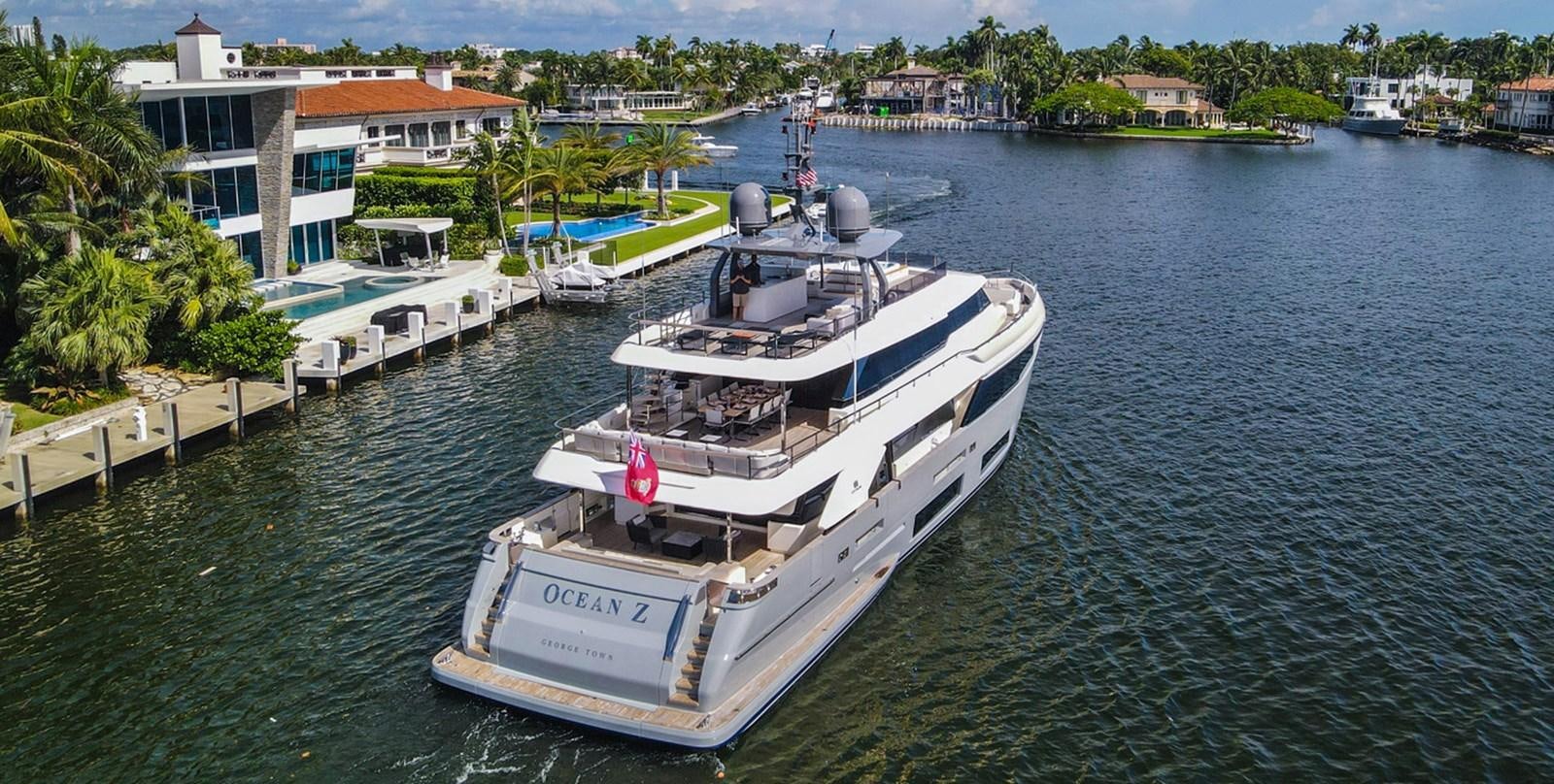 a large white boat in a harbor aboard OCEAN Z Yacht for Sale