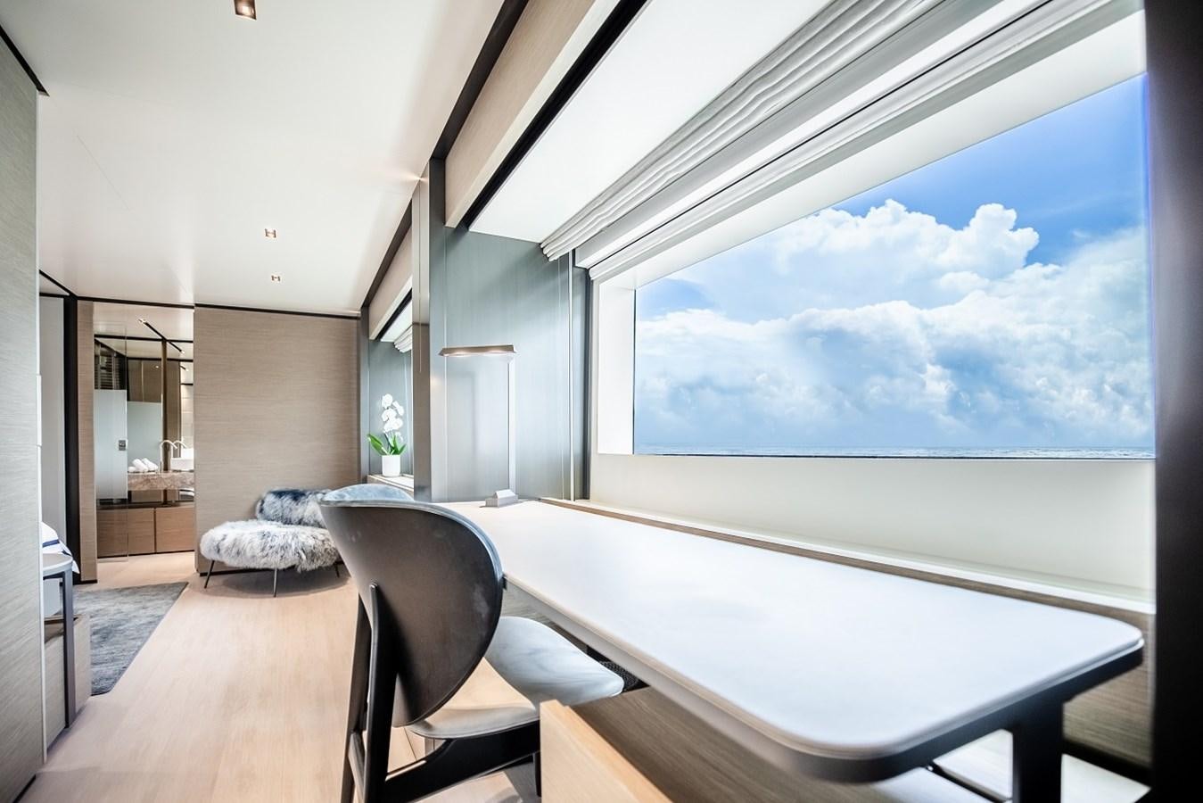 a room with a large window aboard OCEAN Z Yacht for Sale