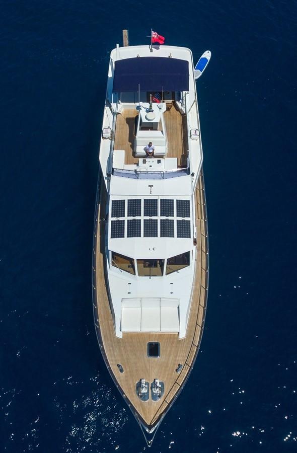 a tall white and black boat aboard ENIGMA BLUE Yacht for Sale