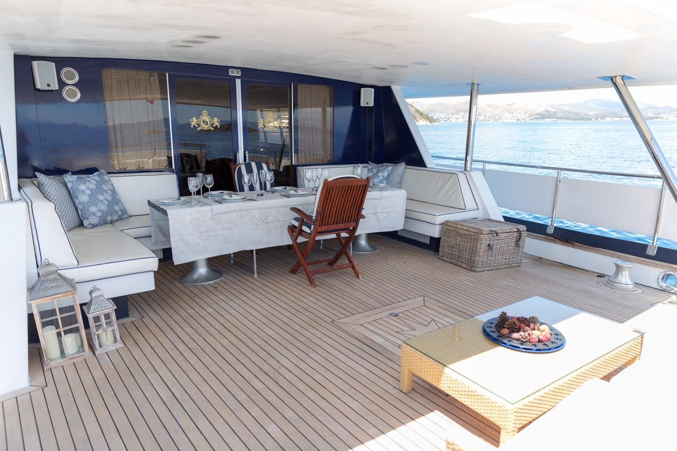 a living room with a large balcony aboard ENIGMA BLUE Yacht for Sale