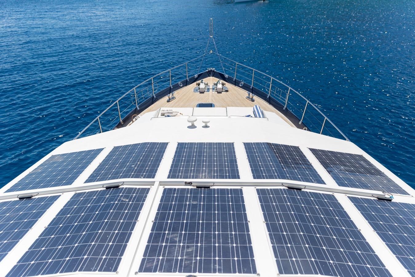 a white building with a white railing aboard ENIGMA BLUE Yacht for Sale