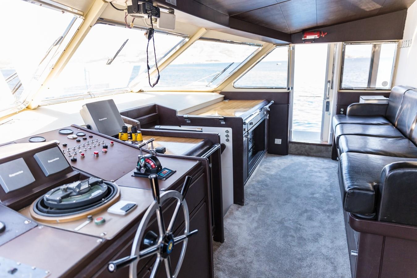inside of a vehicle with a large fan and a table with a fan aboard ENIGMA BLUE Yacht for Sale