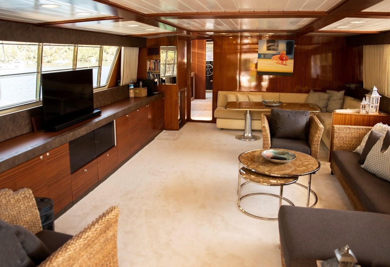 a living room with a piano aboard ENIGMA BLUE Yacht for Sale