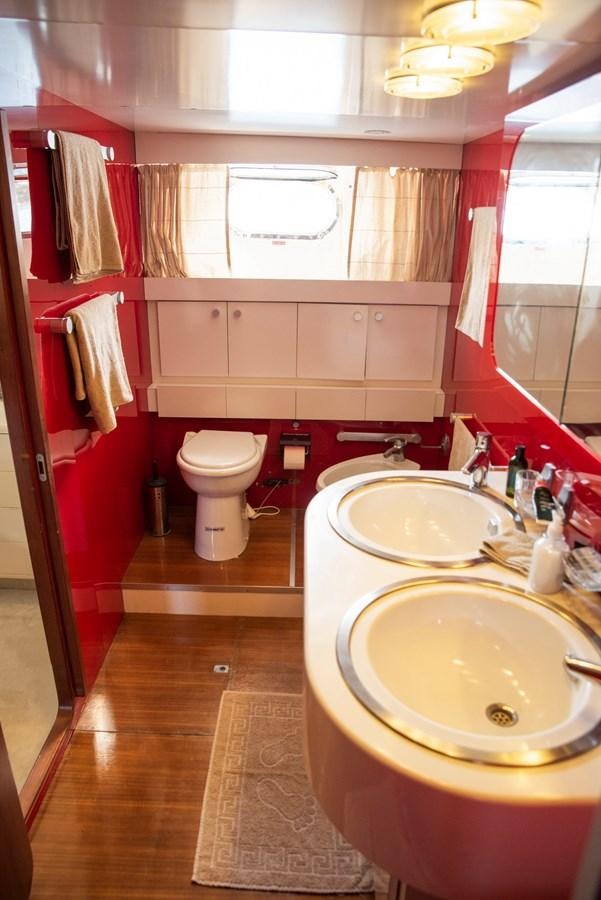a bathroom with red towels aboard ENIGMA BLUE Yacht for Sale