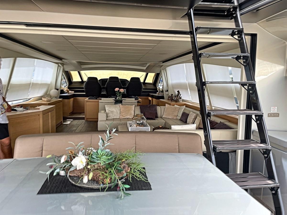 a staircase with a glass window aboard X-TREM I Yacht for Sale