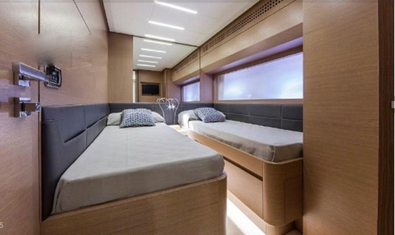 a room with two beds aboard X-TREM I Yacht for Sale