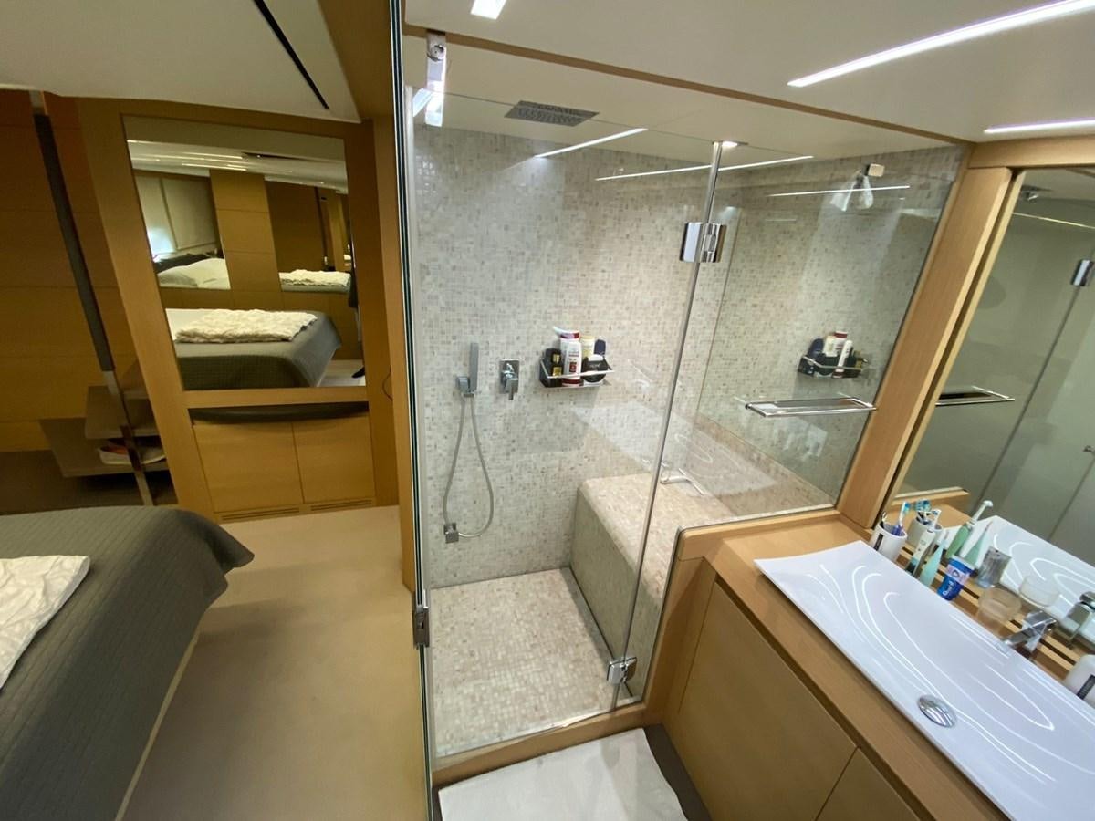 a bathroom with a glass shower aboard X-TREM I Yacht for Sale