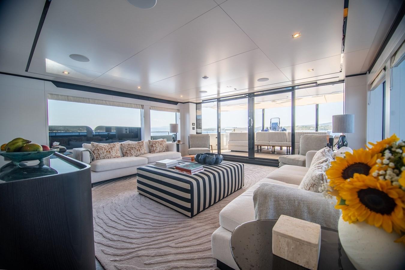 a living room with a large window aboard FOX Yacht for Sale