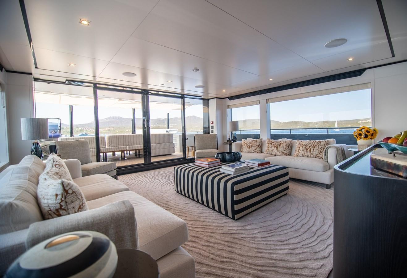 a living room with a large window aboard FOX Yacht for Sale