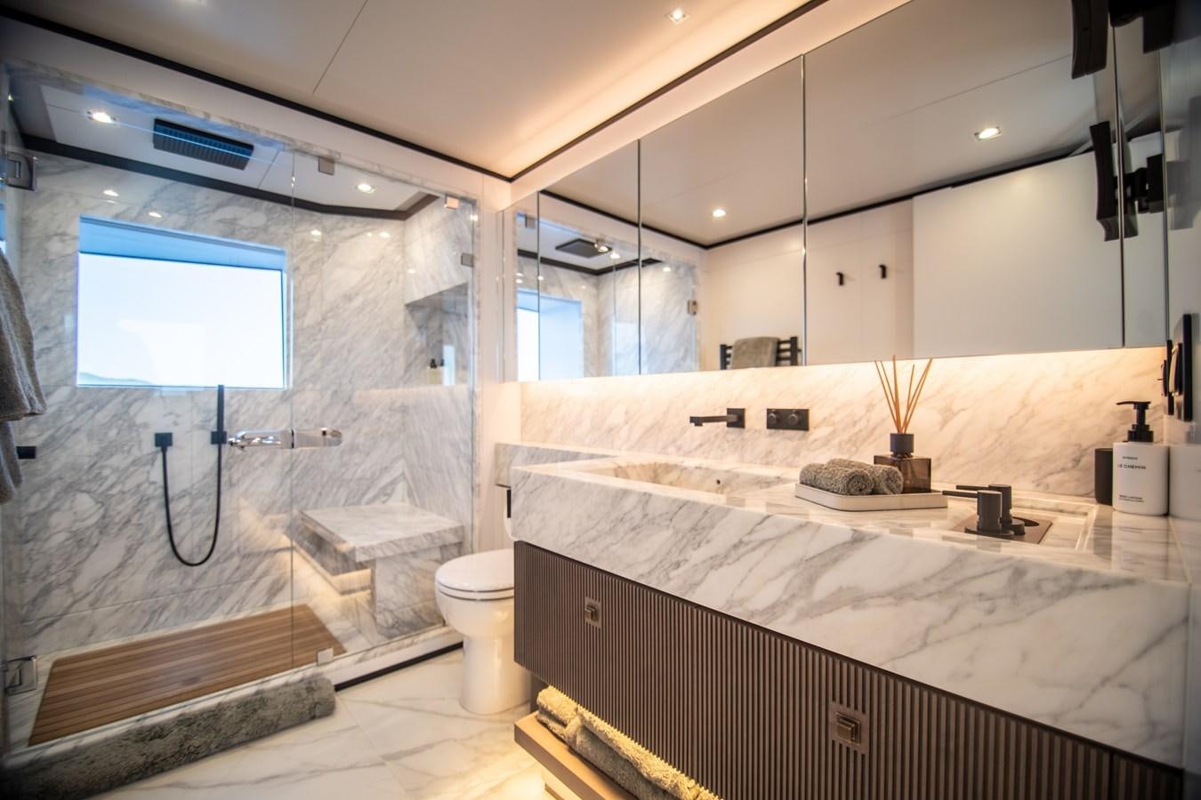 a bathroom with a tub and a sink aboard FOX Yacht for Sale