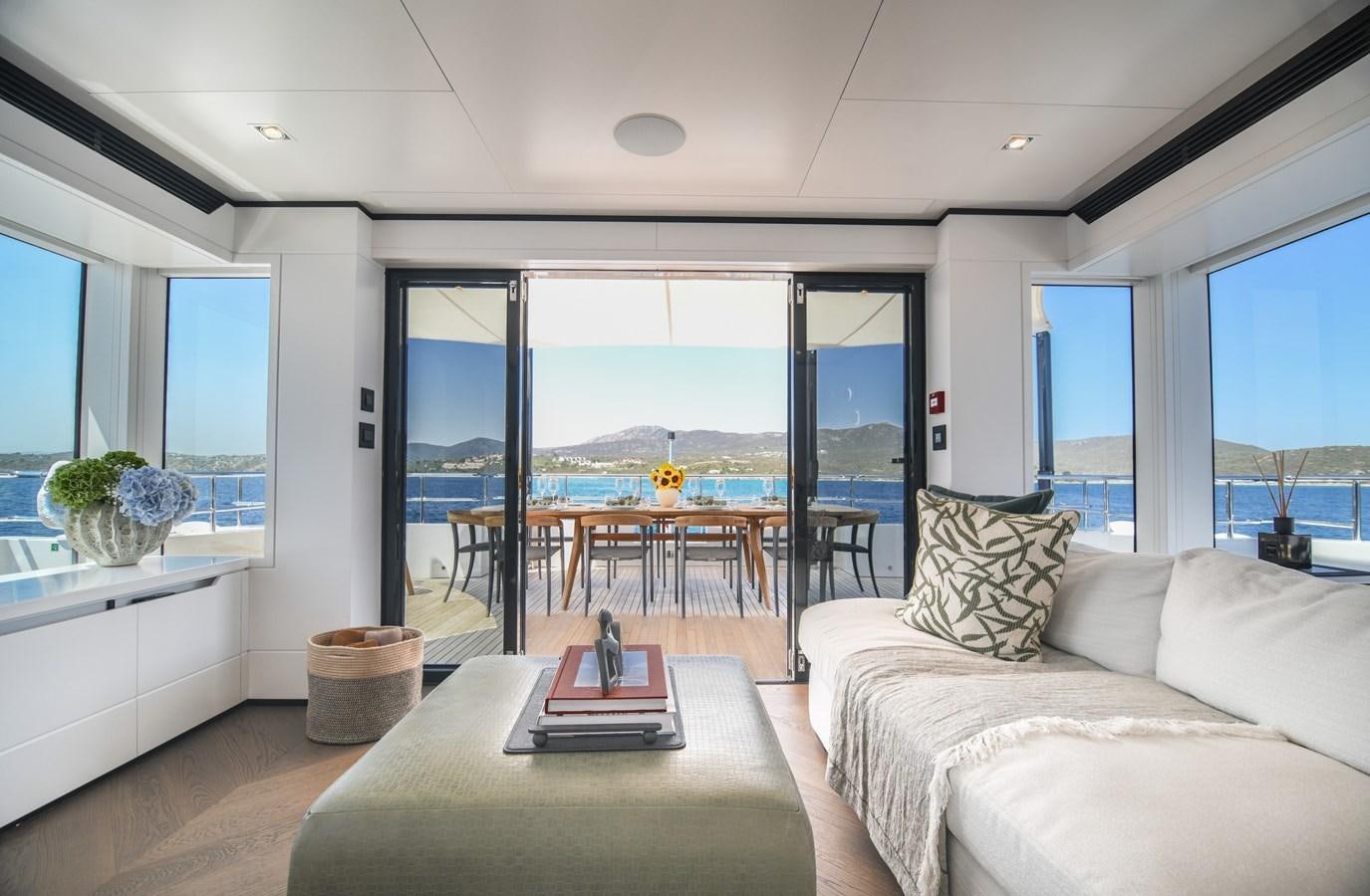 a living room with a large window aboard FOX Yacht for Sale