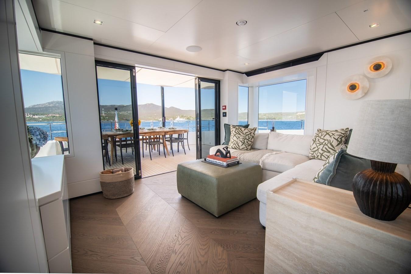 a living room with a large window aboard FOX Yacht for Sale
