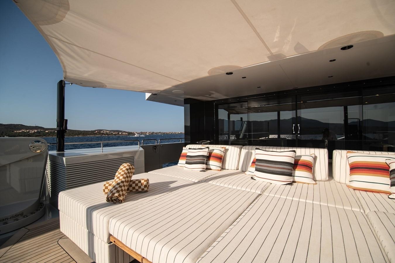 a large white bed with a white sheet on it aboard FOX Yacht for Sale