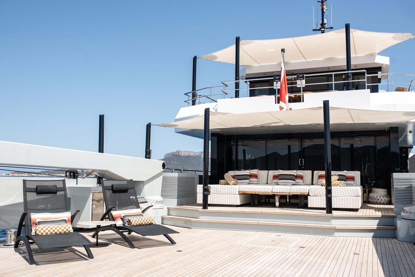 a building with a table and chairs outside aboard FOX Yacht for Sale