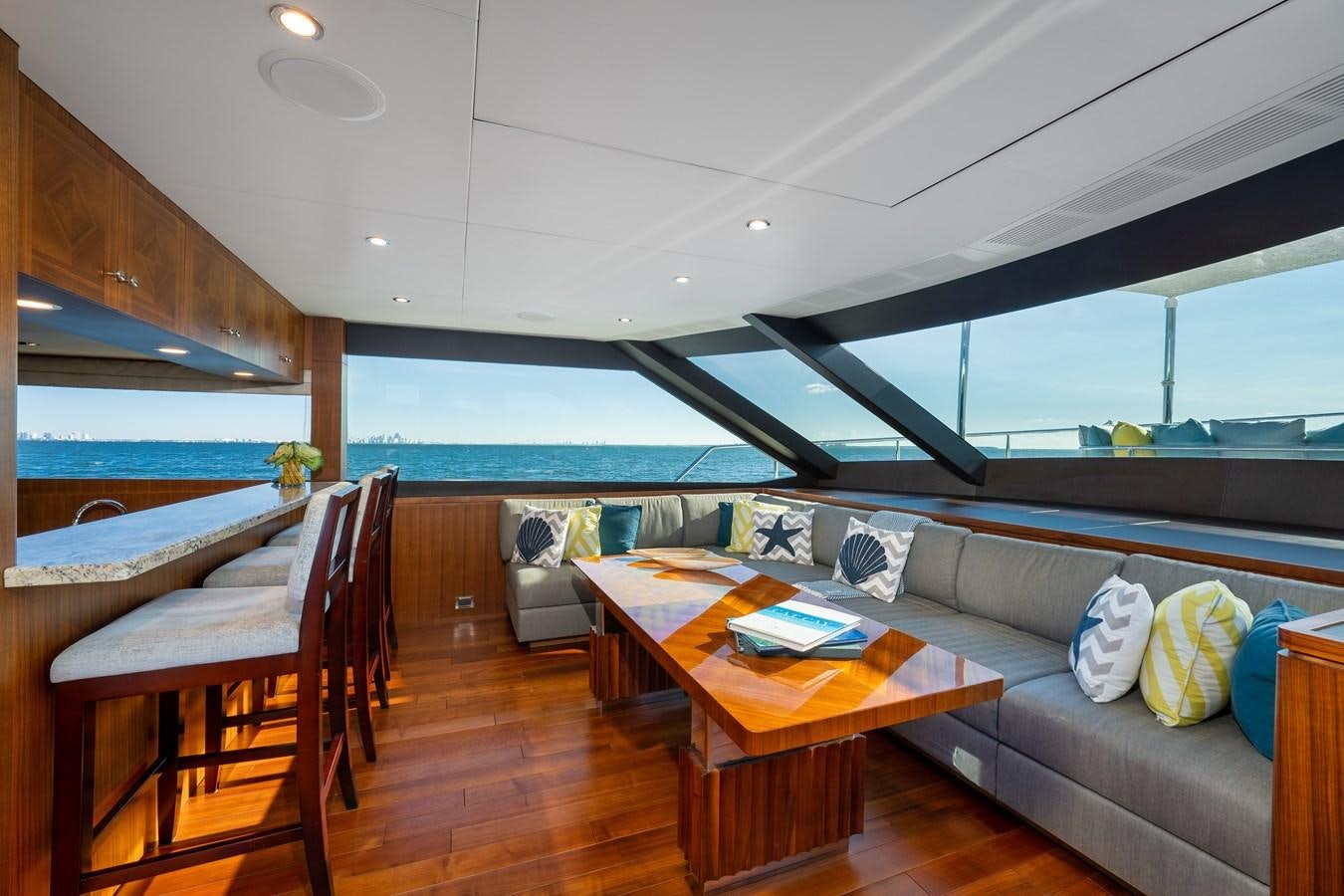 a living room with a couch and a table aboard SEA N SEA Yacht for Charter