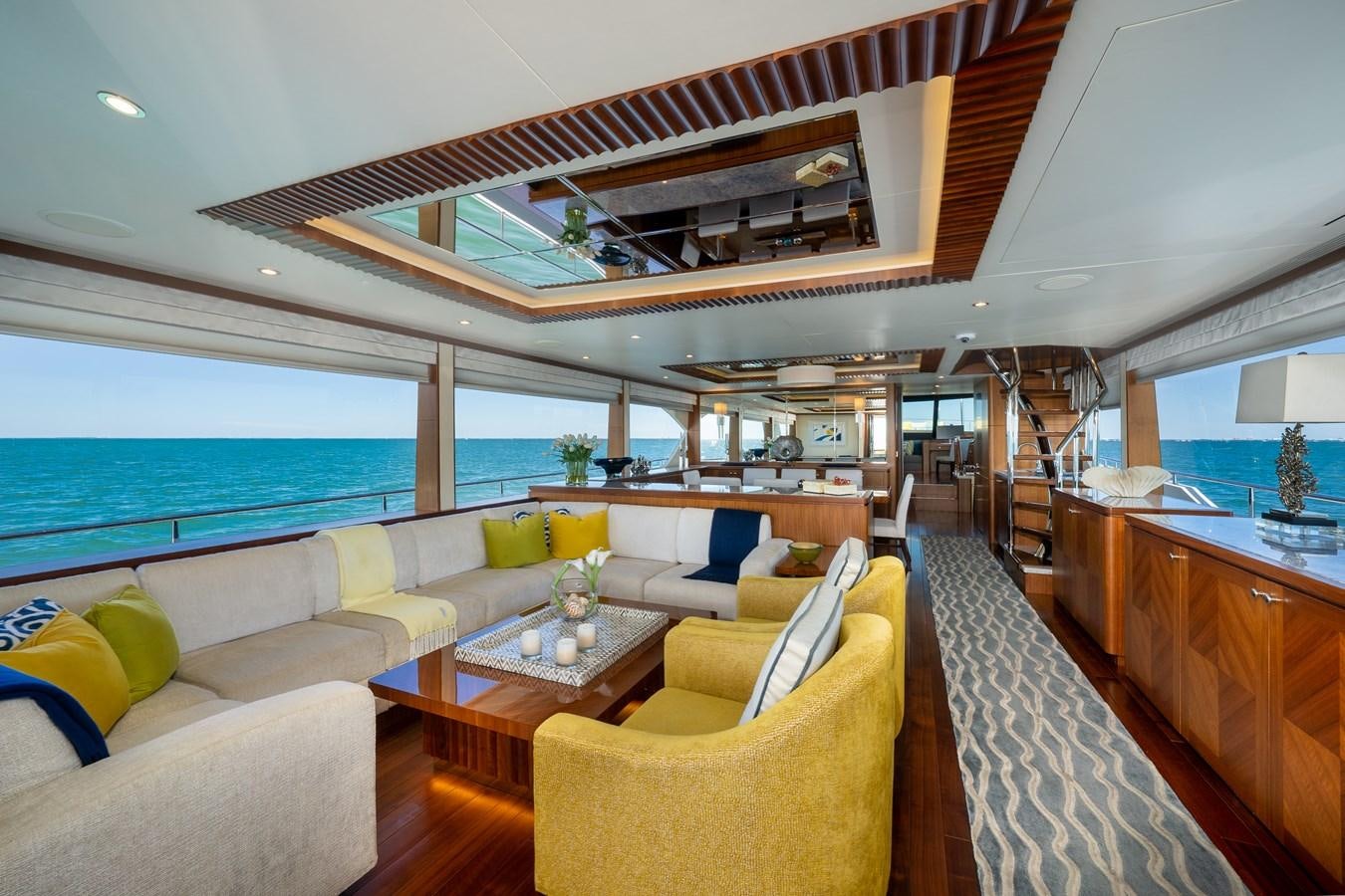 a living room with a large balcony aboard SEA N SEA Yacht for Sale