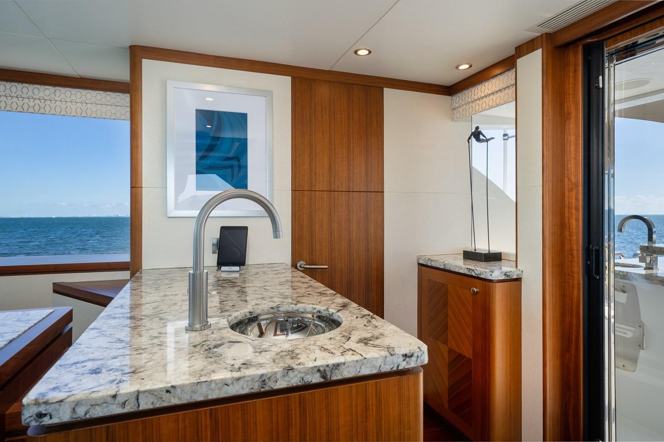 a kitchen with a sink and a window aboard SEA N SEA Yacht for Charter