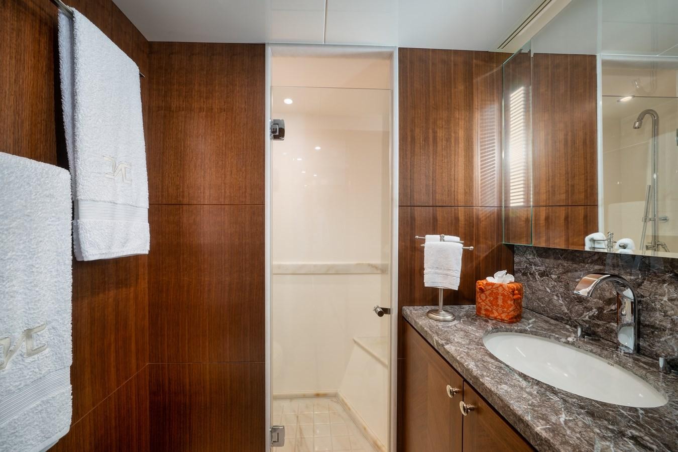 a bathroom with a sink and a mirror aboard SEA N SEA Yacht for Charter
