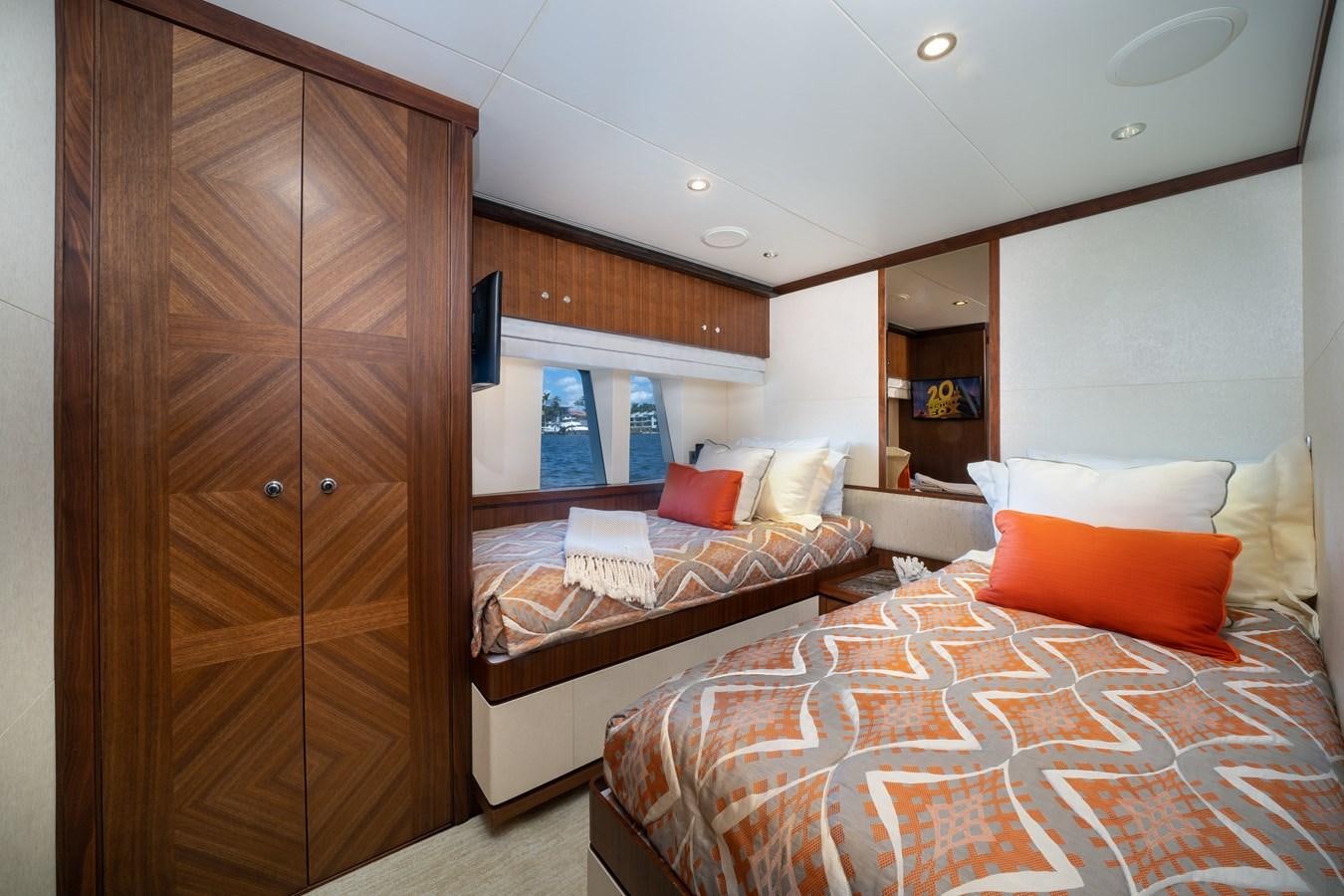 a room with a bed and a closet aboard SEA N SEA Yacht for Charter
