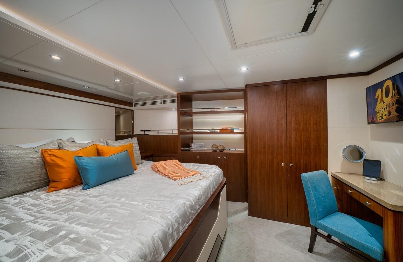 a bedroom with a bed and desk aboard SEA N SEA Yacht for Charter