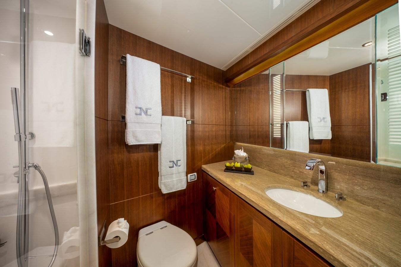 a bathroom with a sink and toilet aboard SEA N SEA Yacht for Sale