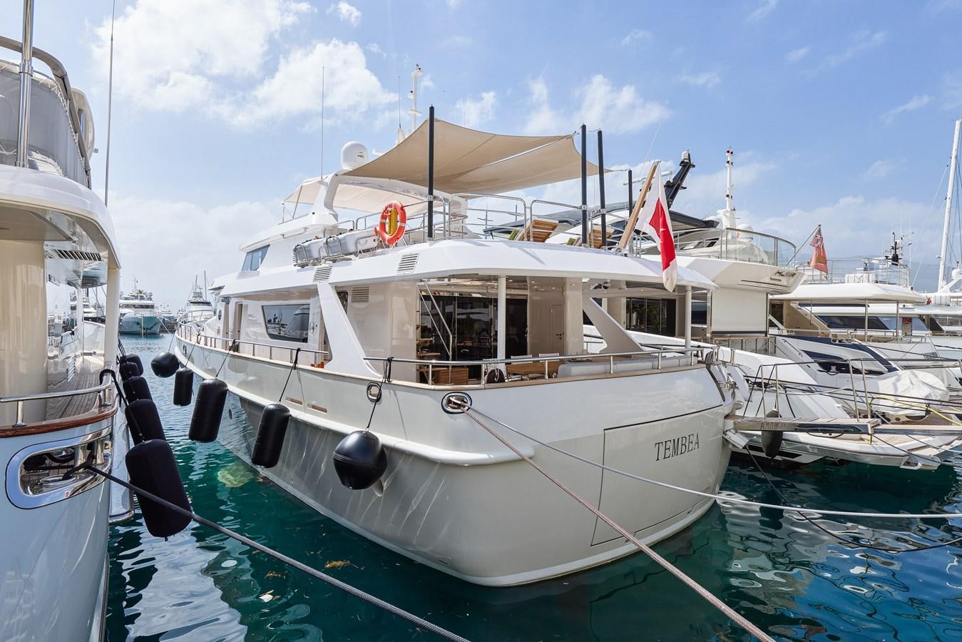 boats docked in a harbor aboard STEEL TRANSATLANTIC NAVETTA 2022 "TEMBEA" Yacht for Sale