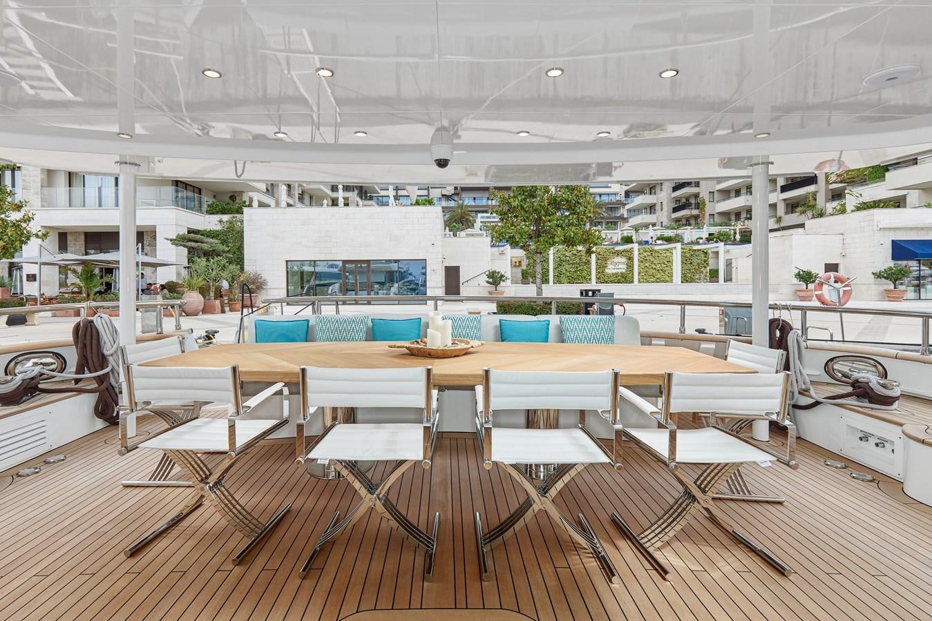 a room with tables and chairs aboard STEEL TRANSATLANTIC NAVETTA 2022 "TEMBEA" Yacht for Sale