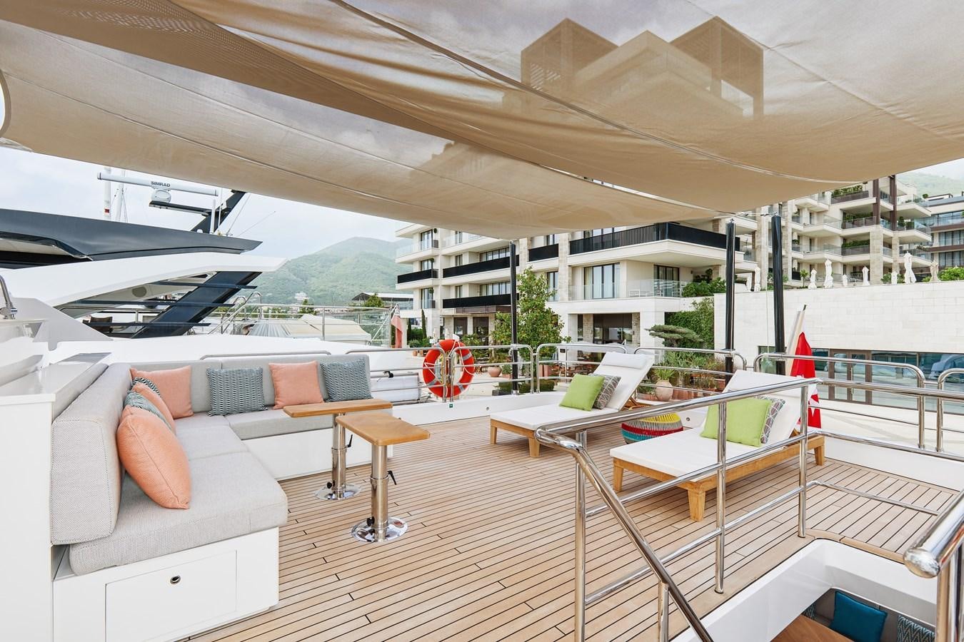 a room with a couch and a table aboard STEEL TRANSATLANTIC NAVETTA 2022 "TEMBEA" Yacht for Sale