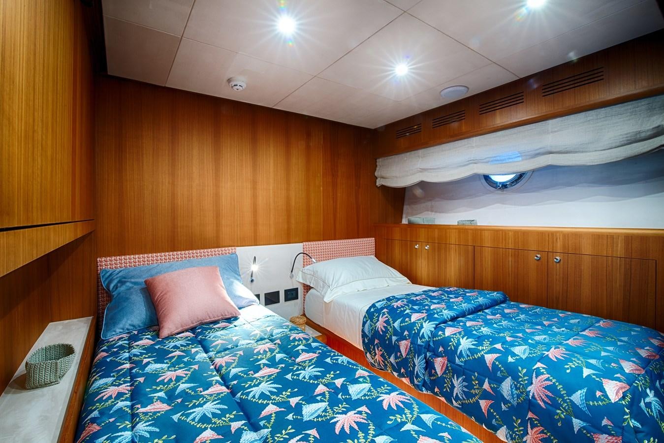 a couple of beds in a room aboard STEEL TRANSATLANTIC NAVETTA 2022 "TEMBEA" Yacht for Sale