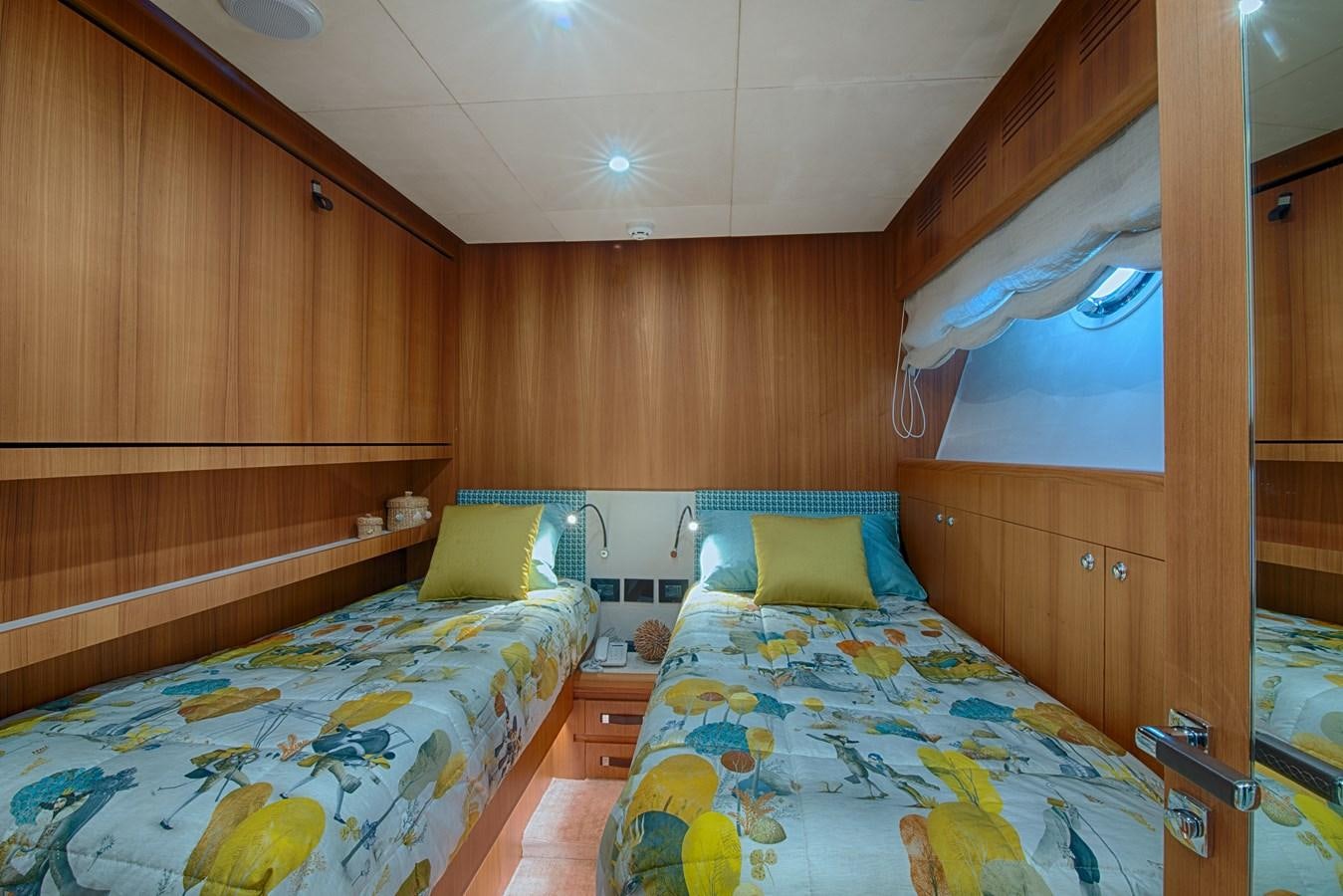 a couple of beds in a room aboard STEEL TRANSATLANTIC NAVETTA 2022 "TEMBEA" Yacht for Sale
