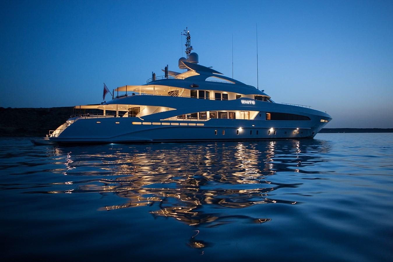 a large boat on the water aboard DAISY D Yacht for Sale