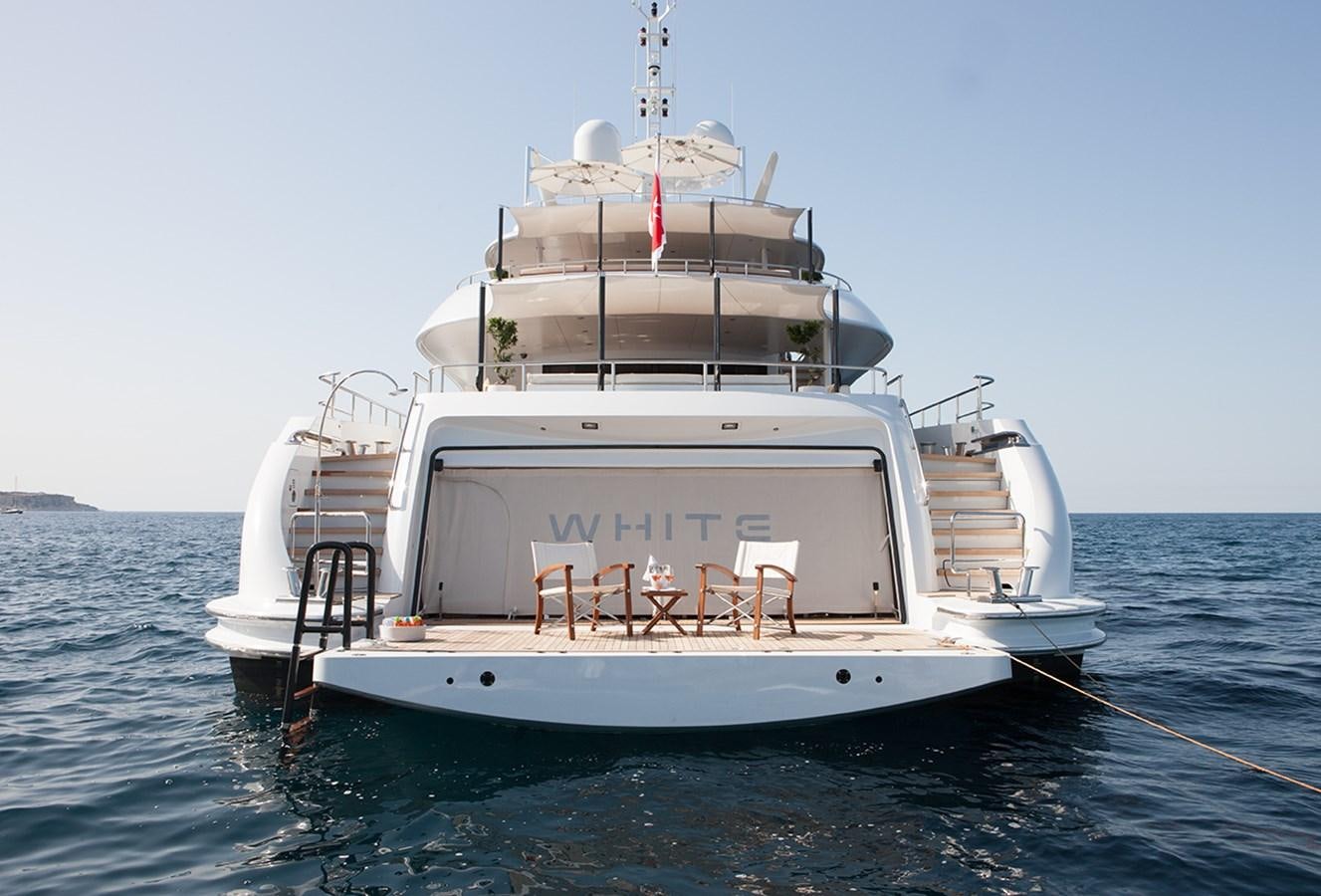 a large white boat in the water aboard DAISY D Yacht for Sale