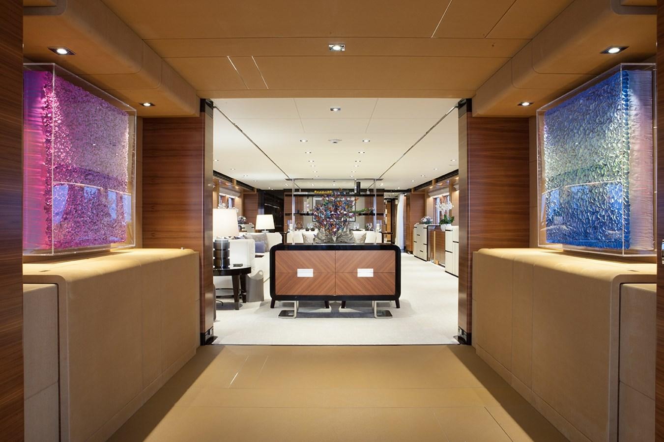 a room with a large window and a desk with a computer on it aboard DAISY D Yacht for Sale