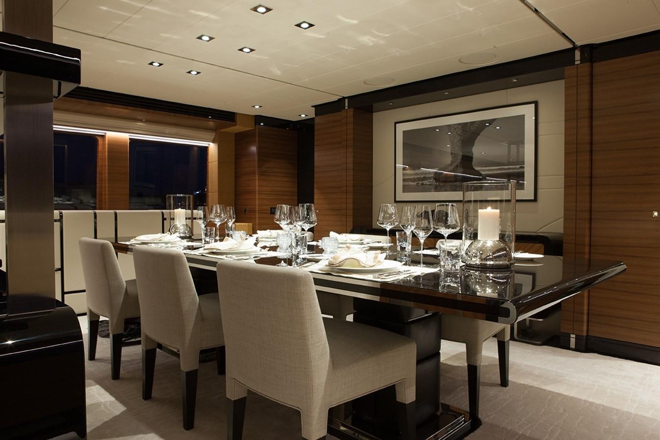 a conference room with a table and chairs aboard DAISY D Yacht for Sale