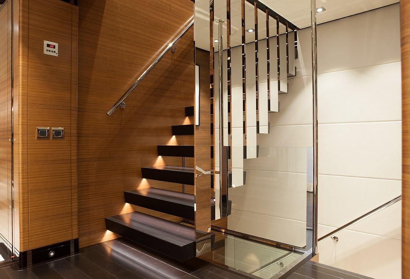 a staircase in a building aboard DAISY D Yacht for Sale