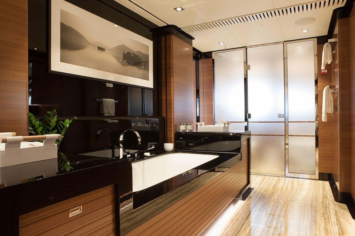 a kitchen with a large island aboard DAISY D Yacht for Sale