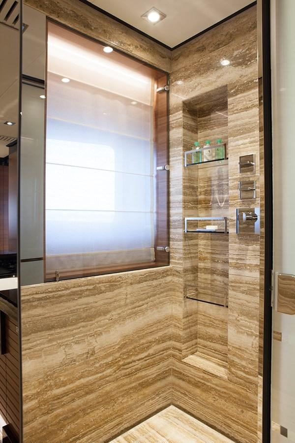 a room with a glass wall aboard DAISY D Yacht for Sale