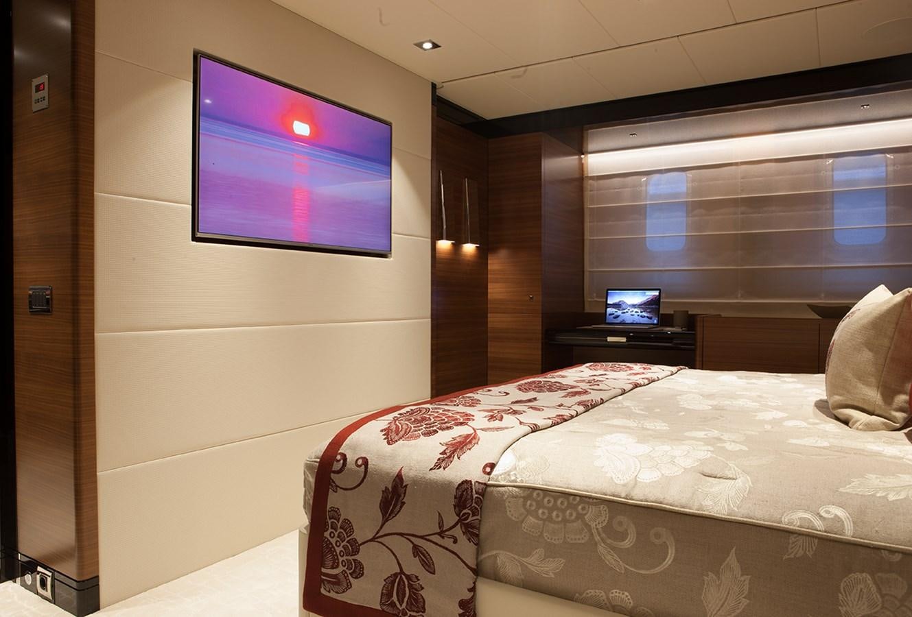 a room with a tv and a bed aboard DAISY D Yacht for Sale