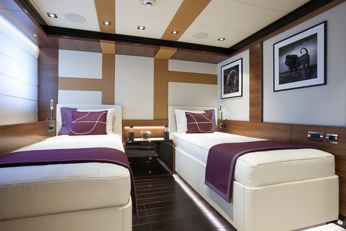 a room with two beds aboard DAISY D Yacht for Sale