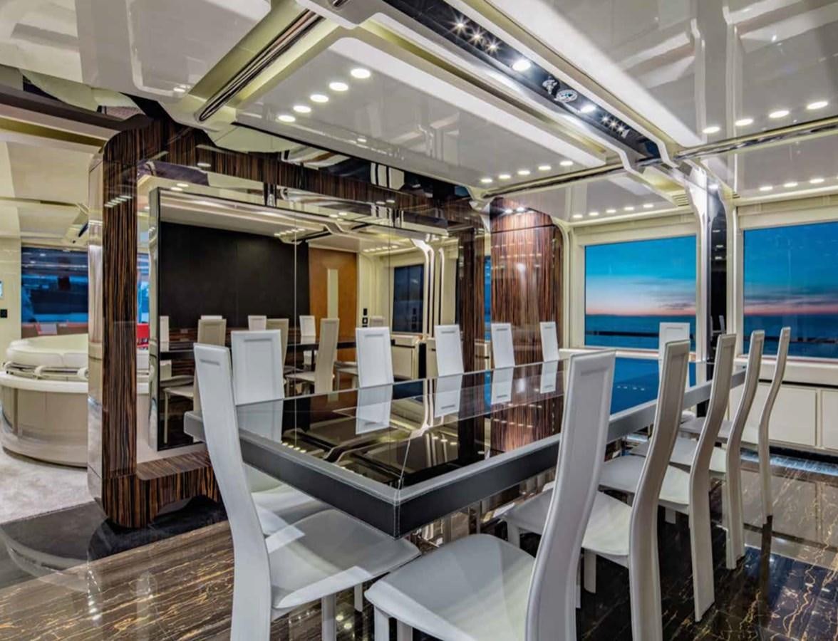 a room with chairs and tables aboard EUPHORIA II Yacht for Sale