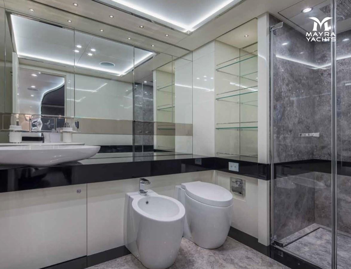 a bathroom with a glass shower aboard EUPHORIA II Yacht for Sale