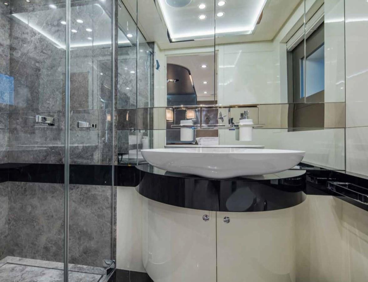 a bathroom with a glass shower aboard EUPHORIA II Yacht for Sale