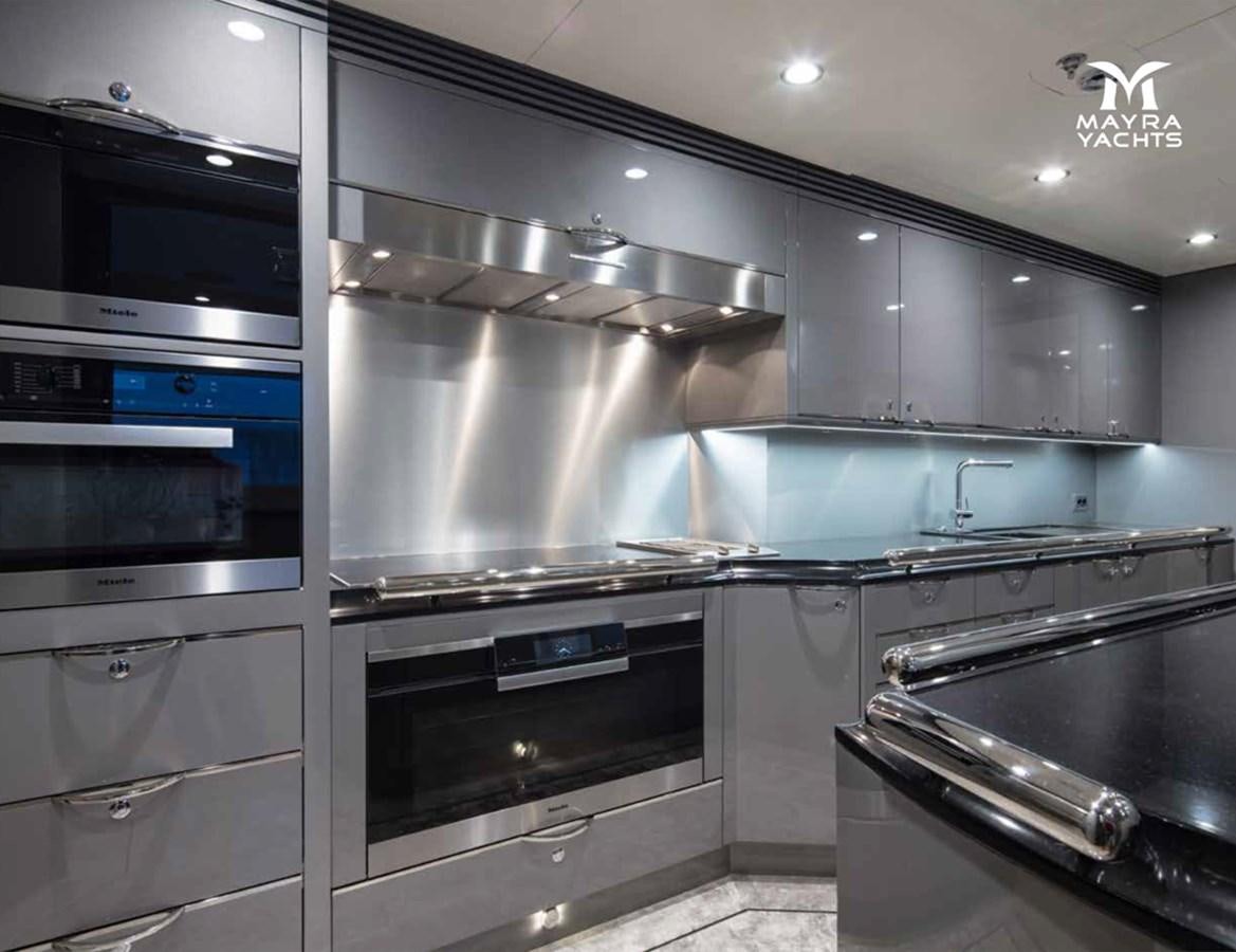a kitchen with stainless steel appliances aboard EUPHORIA II Yacht for Sale
