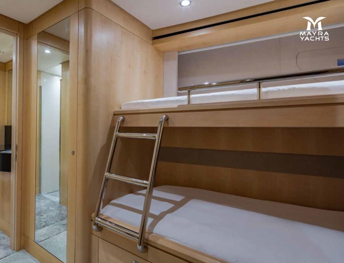 a wooden bunk bed aboard EUPHORIA II Yacht for Sale