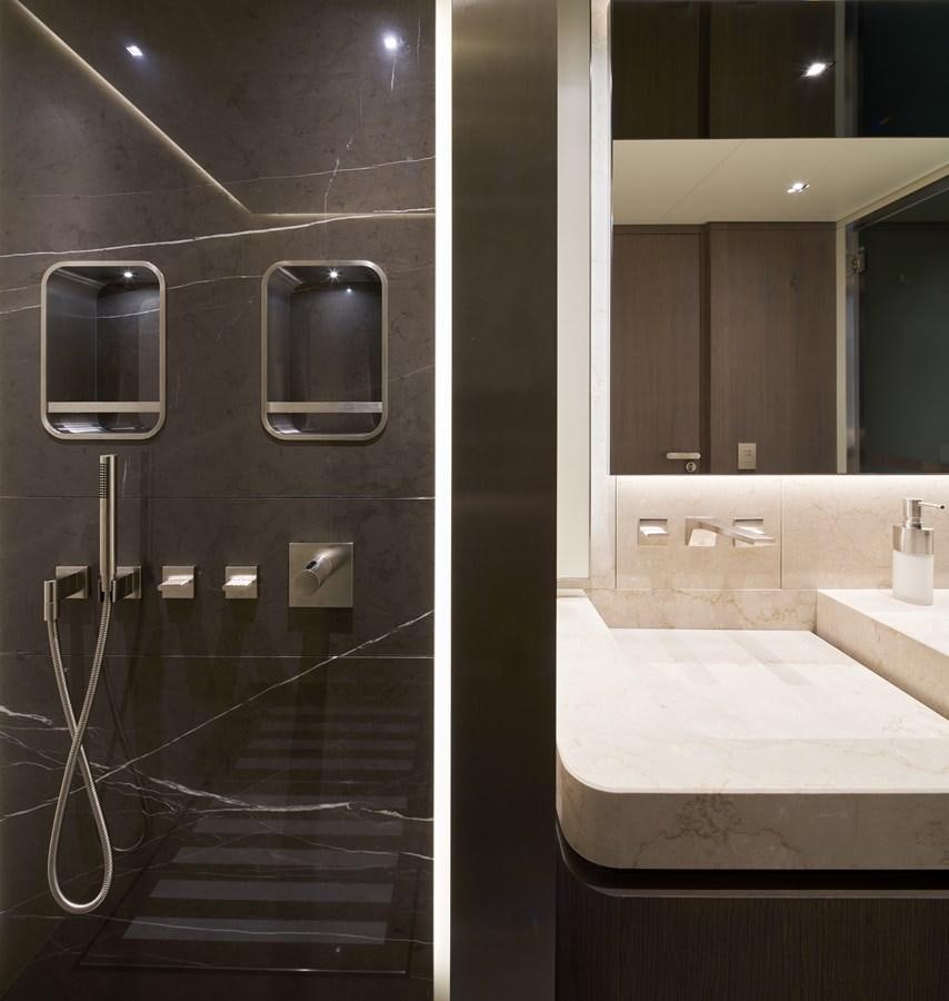 a bathroom with a glass shower aboard SP1 Yacht for Sale
